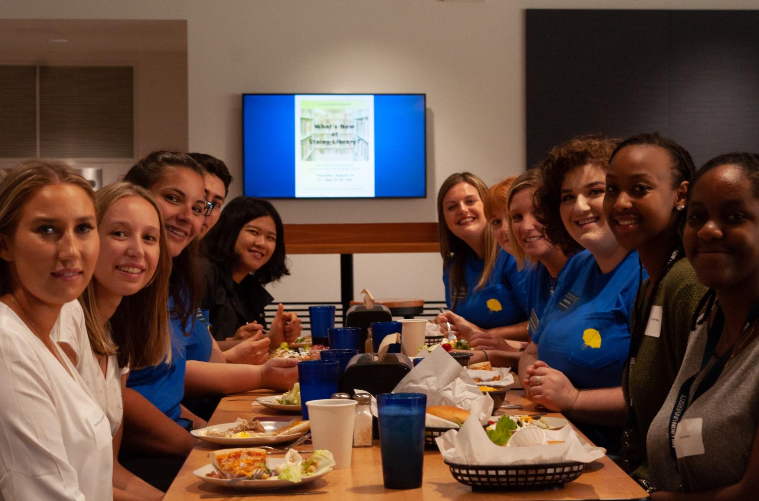 New International Students enjoy dinner with FYEMs for the first time at Millikin in the cafeteria.