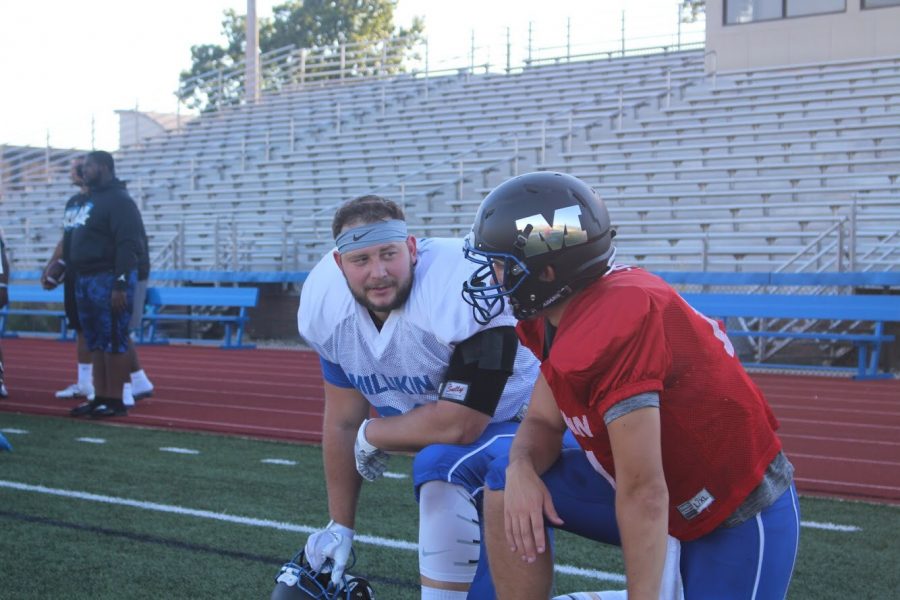 Cal and his tight end Blake Patchett going over strategy.