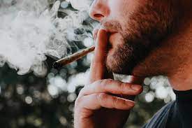A person smoking cannabis.