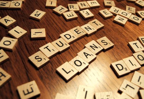 A bunch of random scrabble letters spell out the words Student Loans