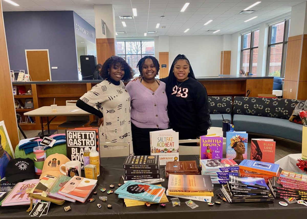 Natia Weathers (Left), Alela Kinyua (Middle), Ashleigh Johnson (Right) helped make the book giveaway a success.