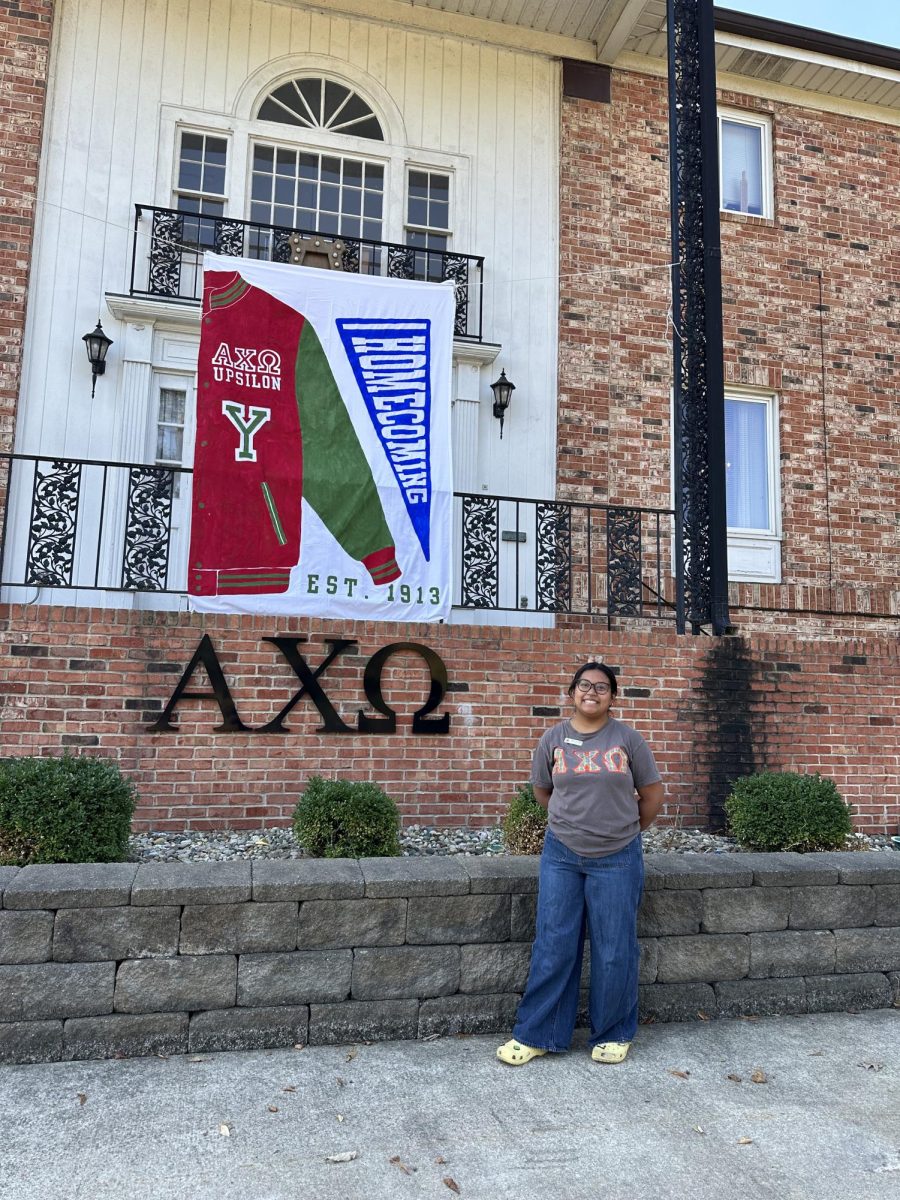 Yumol in front of the Alpha Chi Omega house.